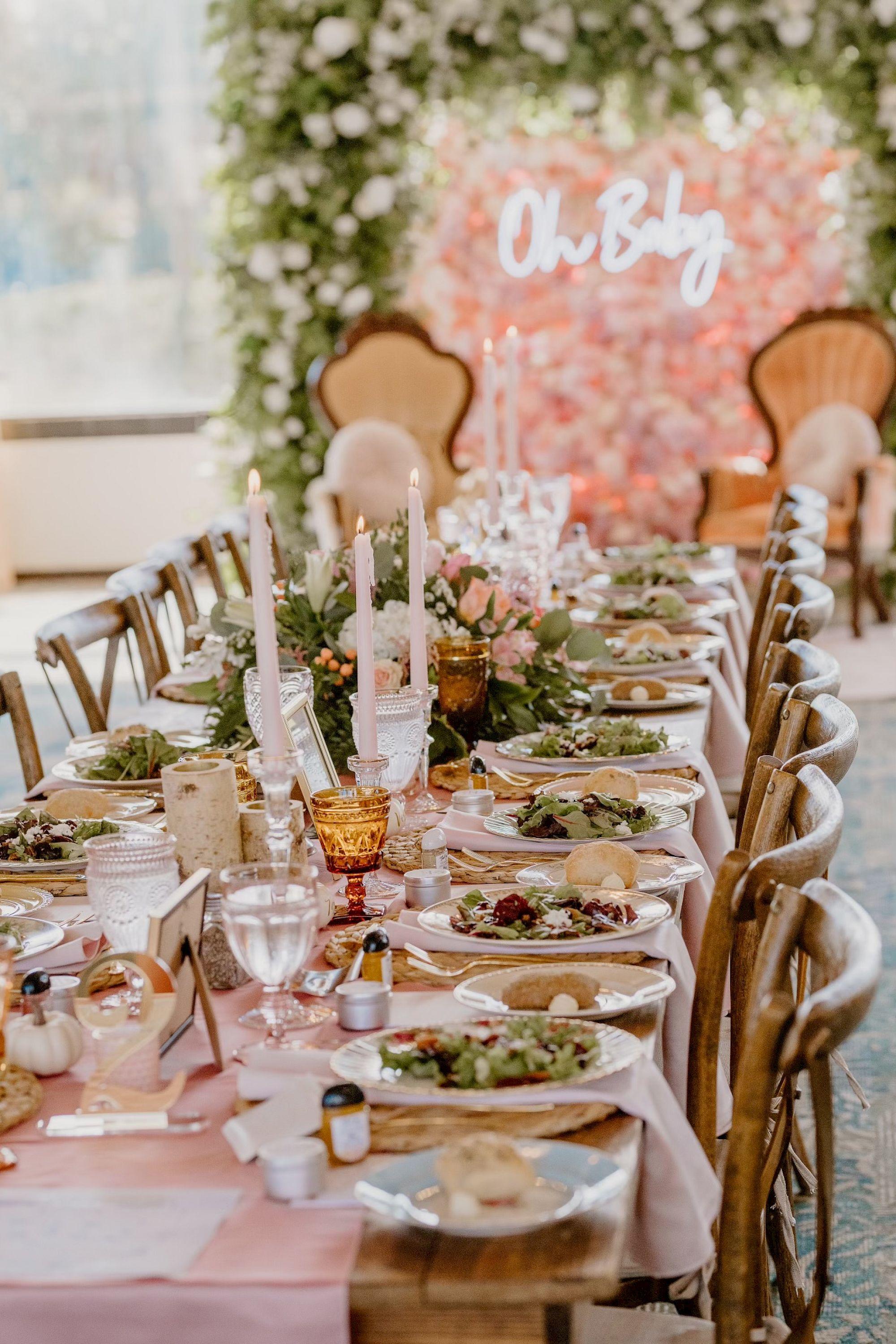 Elegant dining table set for a celebration with gourmet salads, crystal glasses, and floral décor at Saddlebrook Resort — Discover exceptional culinary experiences at Saddlebrook Resort.